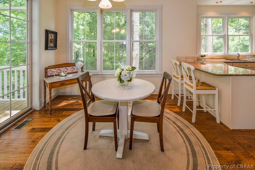 137 Mastons Wharf Road Lancaster, VA 22503 - Photo 10 of 39 a dining room with furniture and a large window