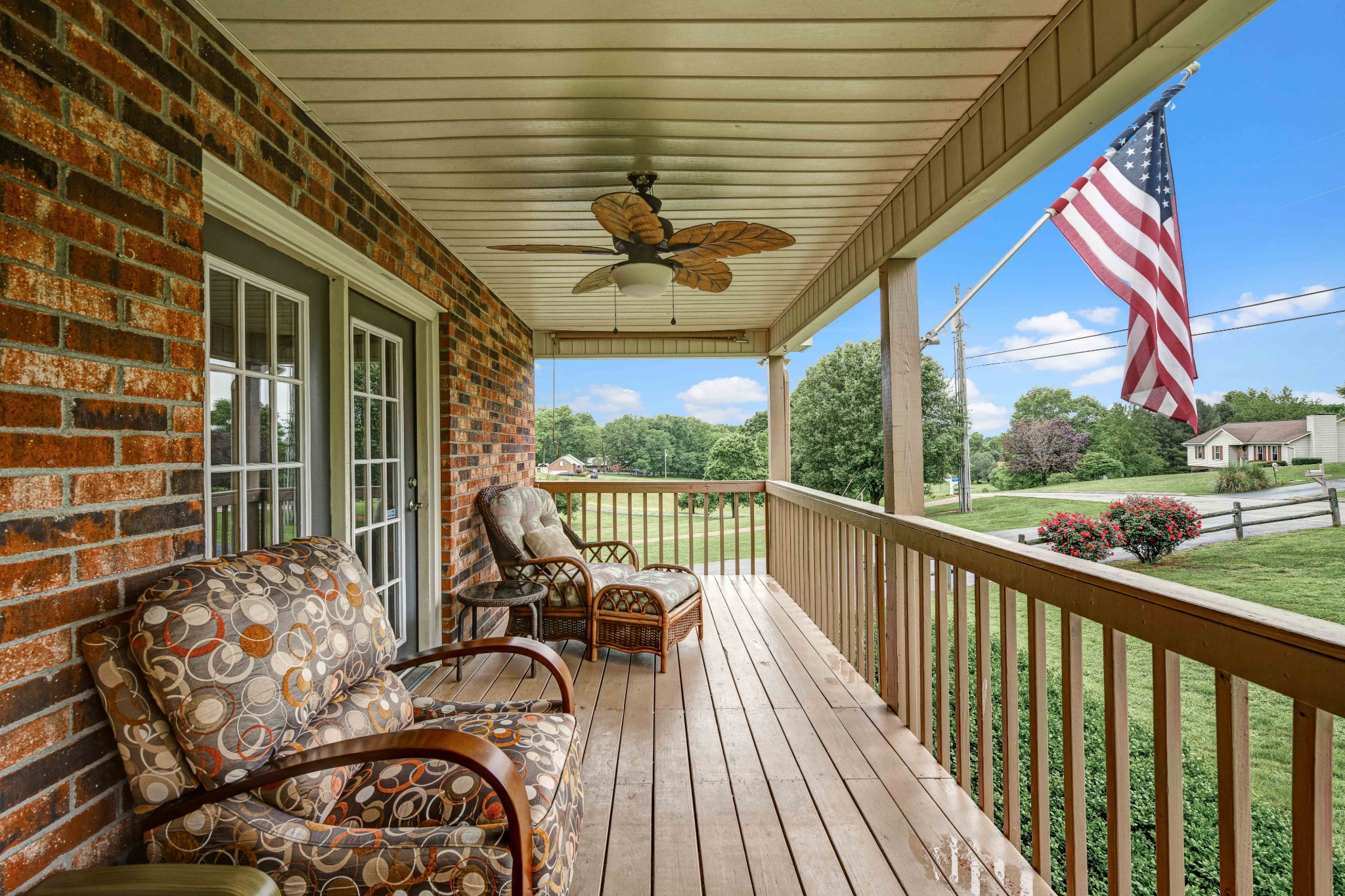 607 Vaughan's Gap Road Spring Hill, TN 37174 - Photo 2 of 34 a balcony with furniture and a large window