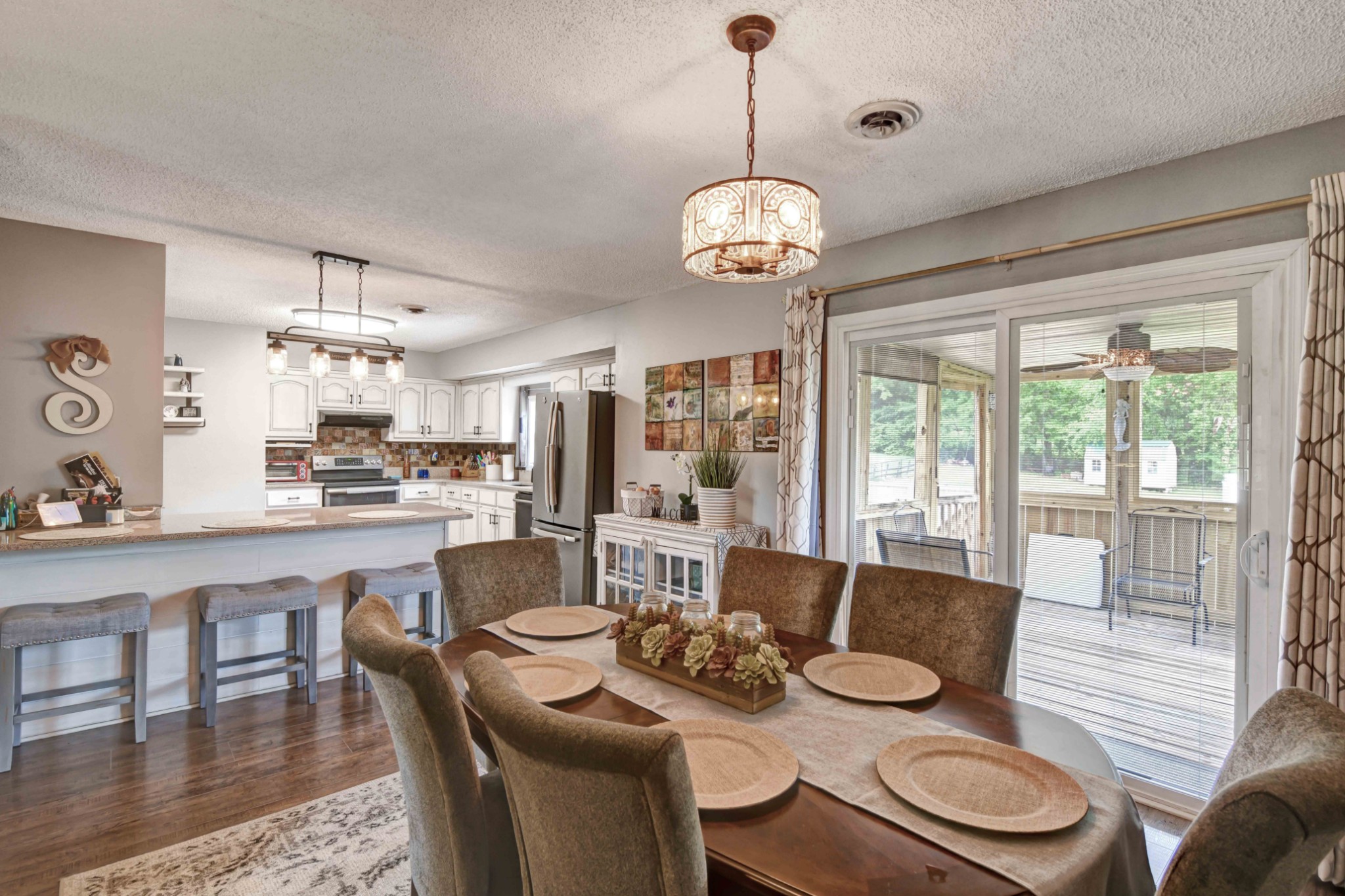 607 Vaughan's Gap Road Spring Hill, TN 37174 - Photo 11 of 34 a view of a dining room with furniture wooden floor and chandelier