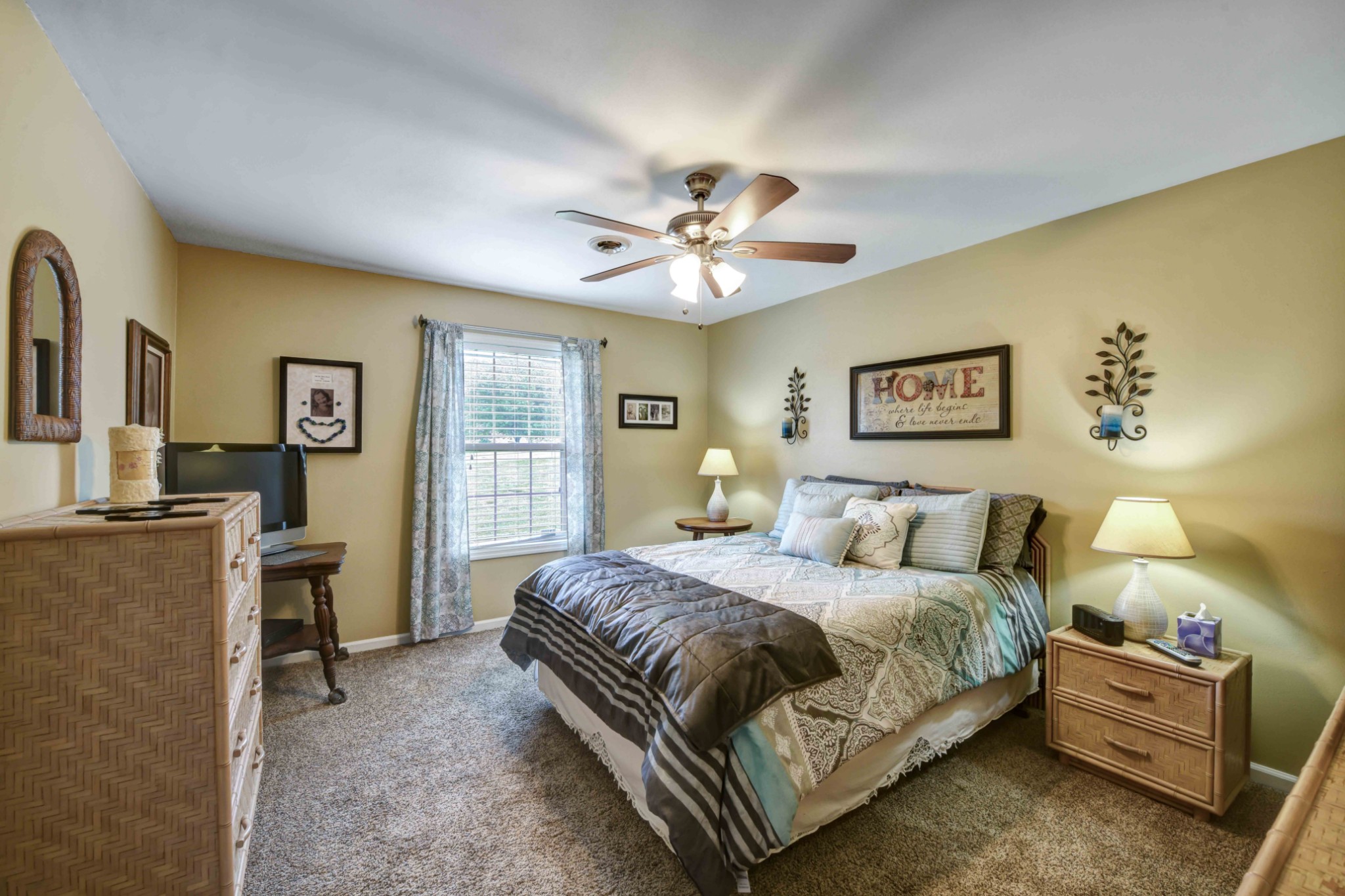 607 Vaughan's Gap Road Spring Hill, TN 37174 - Photo 13 of 34 a bedroom with a bed and a chandelier