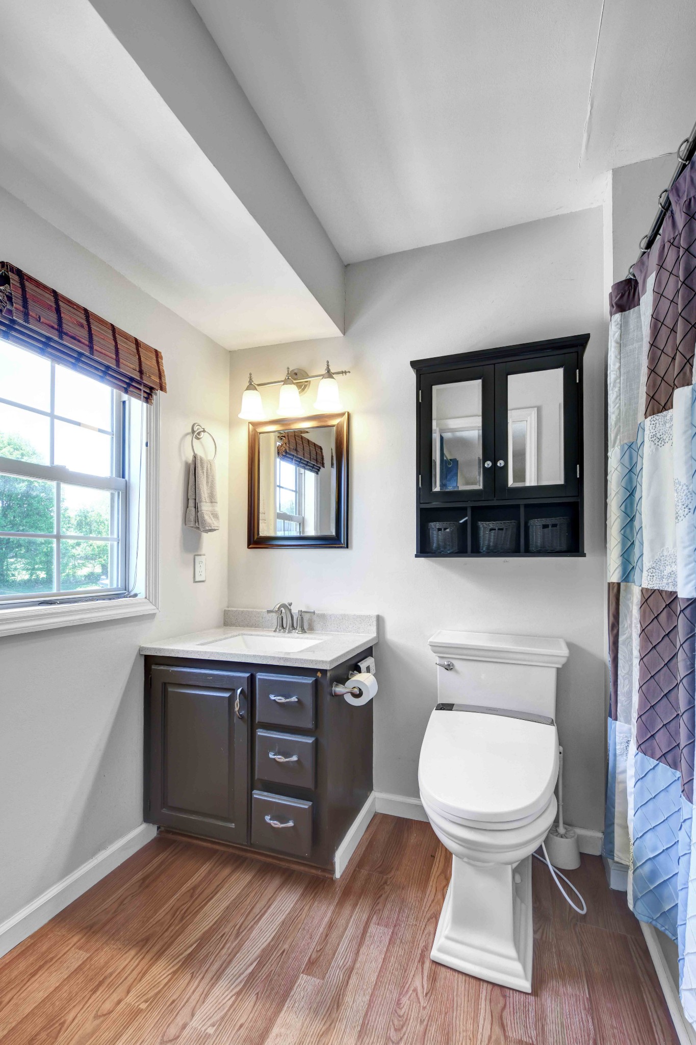 607 Vaughan's Gap Road Spring Hill, TN 37174 - Photo 14 of 34 a spacious bathroom with a toilet a sink and a mirror