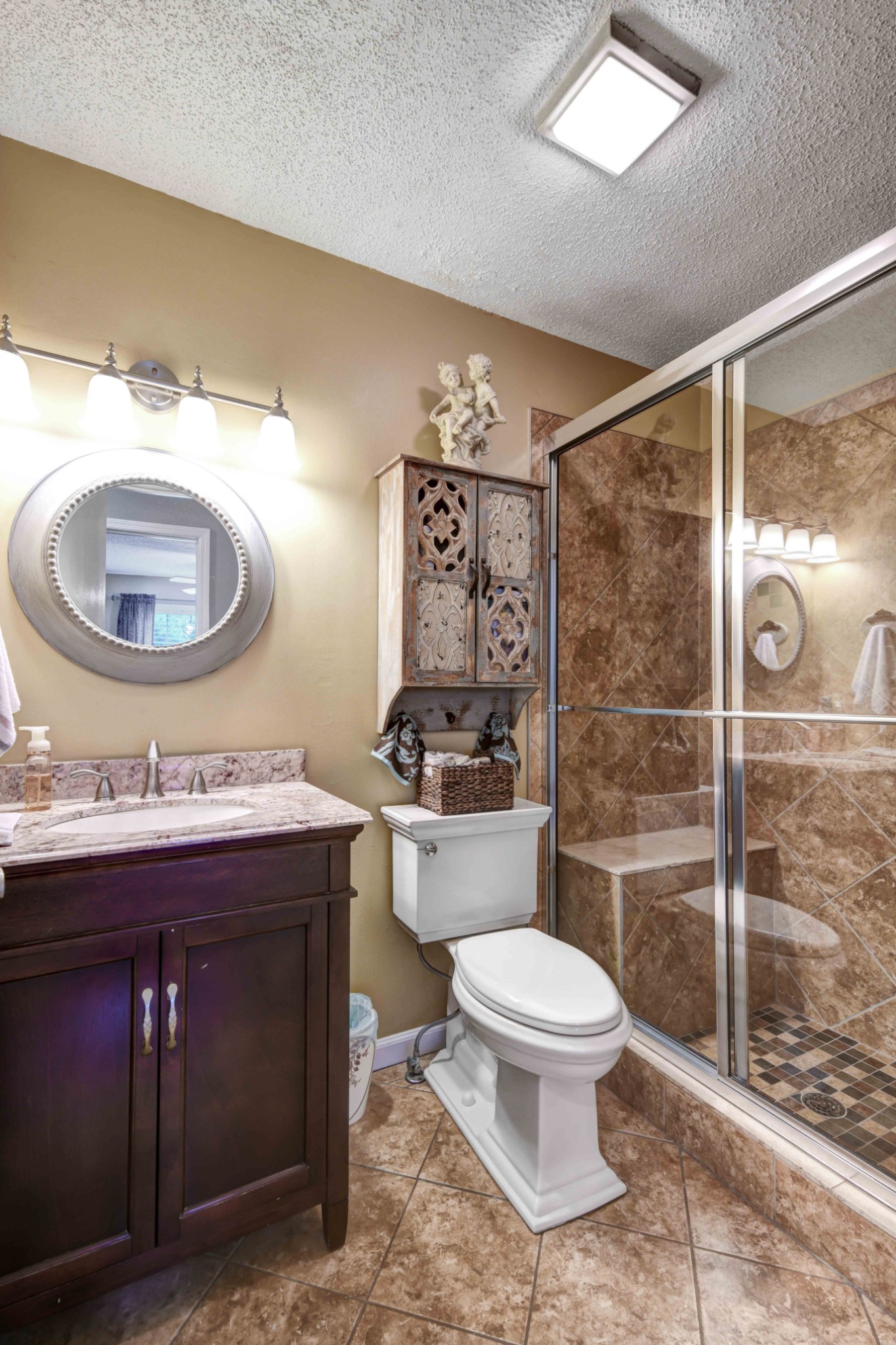 607 Vaughan's Gap Road Spring Hill, TN 37174 - Photo 16 of 34 a bathroom with a toilet a sink and mirror