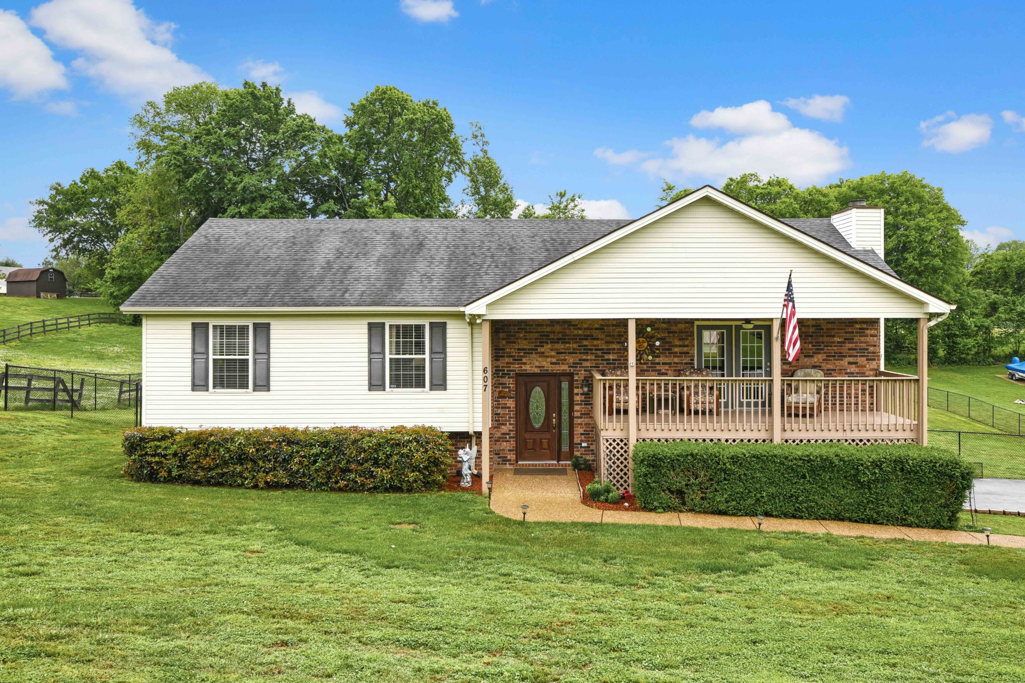 607 Vaughan's Gap Road Spring Hill, TN 37174 - Photo 3 of 34 a view of a house with a yard and a garden