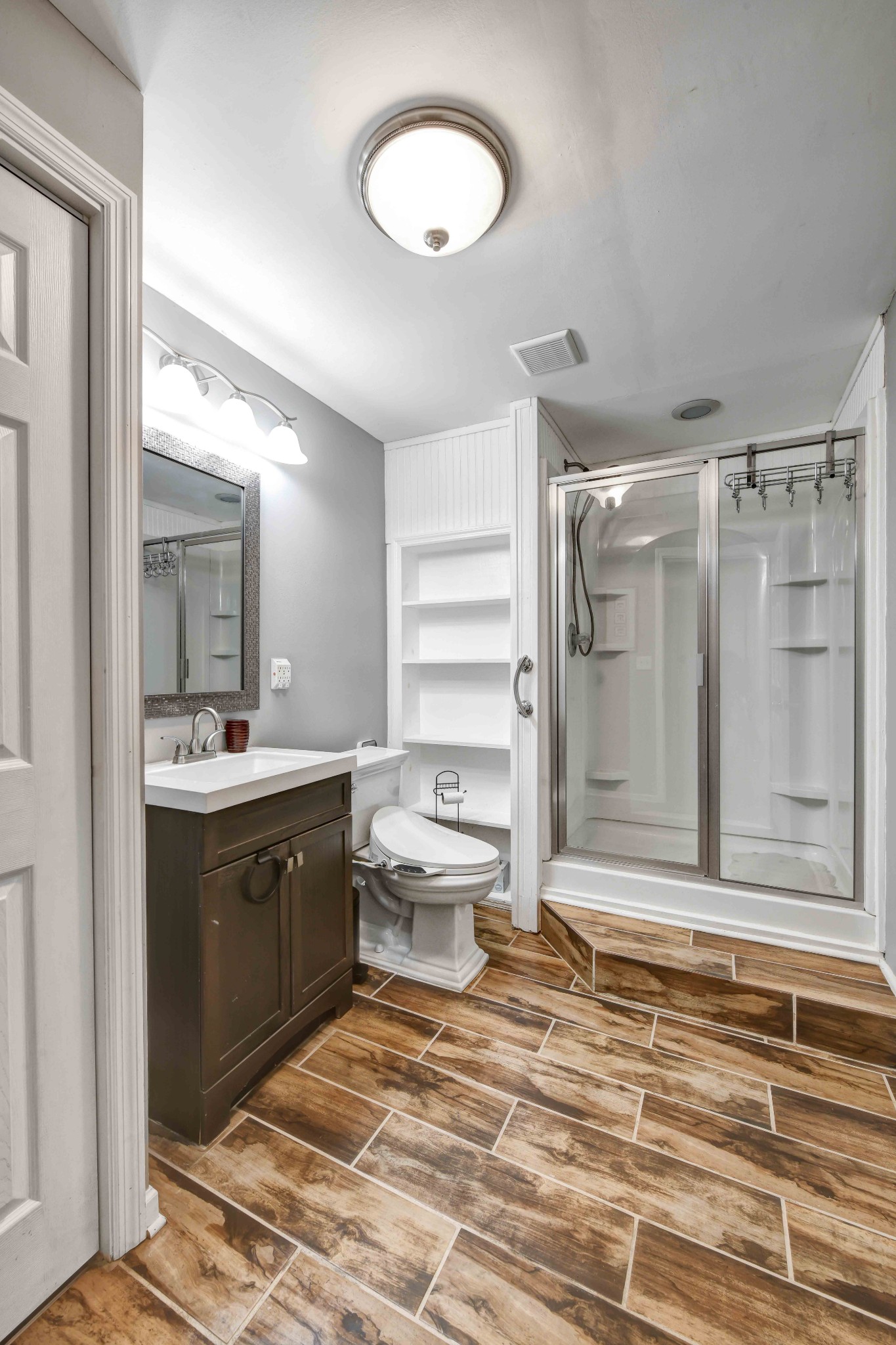 607 Vaughan's Gap Road Spring Hill, TN 37174 - Photo 22 of 34 a bathroom with a sink toilet and shower