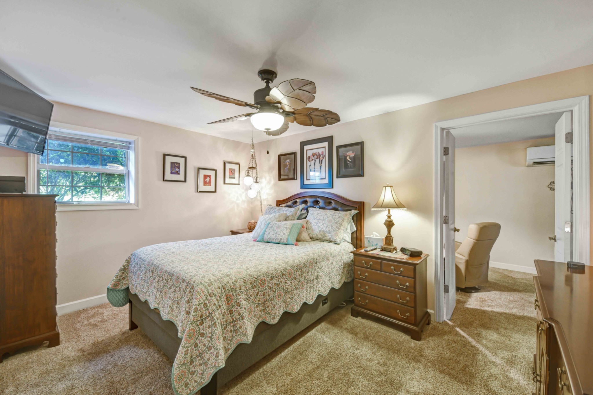 607 Vaughan's Gap Road Spring Hill, TN 37174 - Photo 23 of 34 a bedroom with a bed a chandelier and paintings on the wall