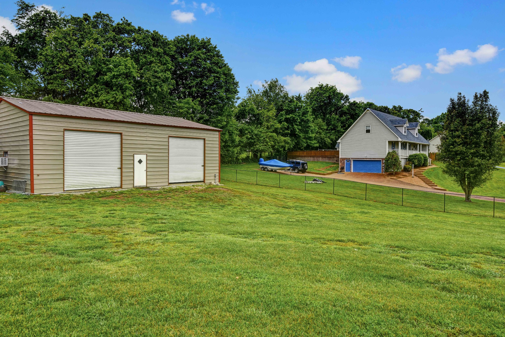 607 Vaughan's Gap Road Spring Hill, TN 37174 - Photo 27 of 34 a front view of house with yard and trees in the background