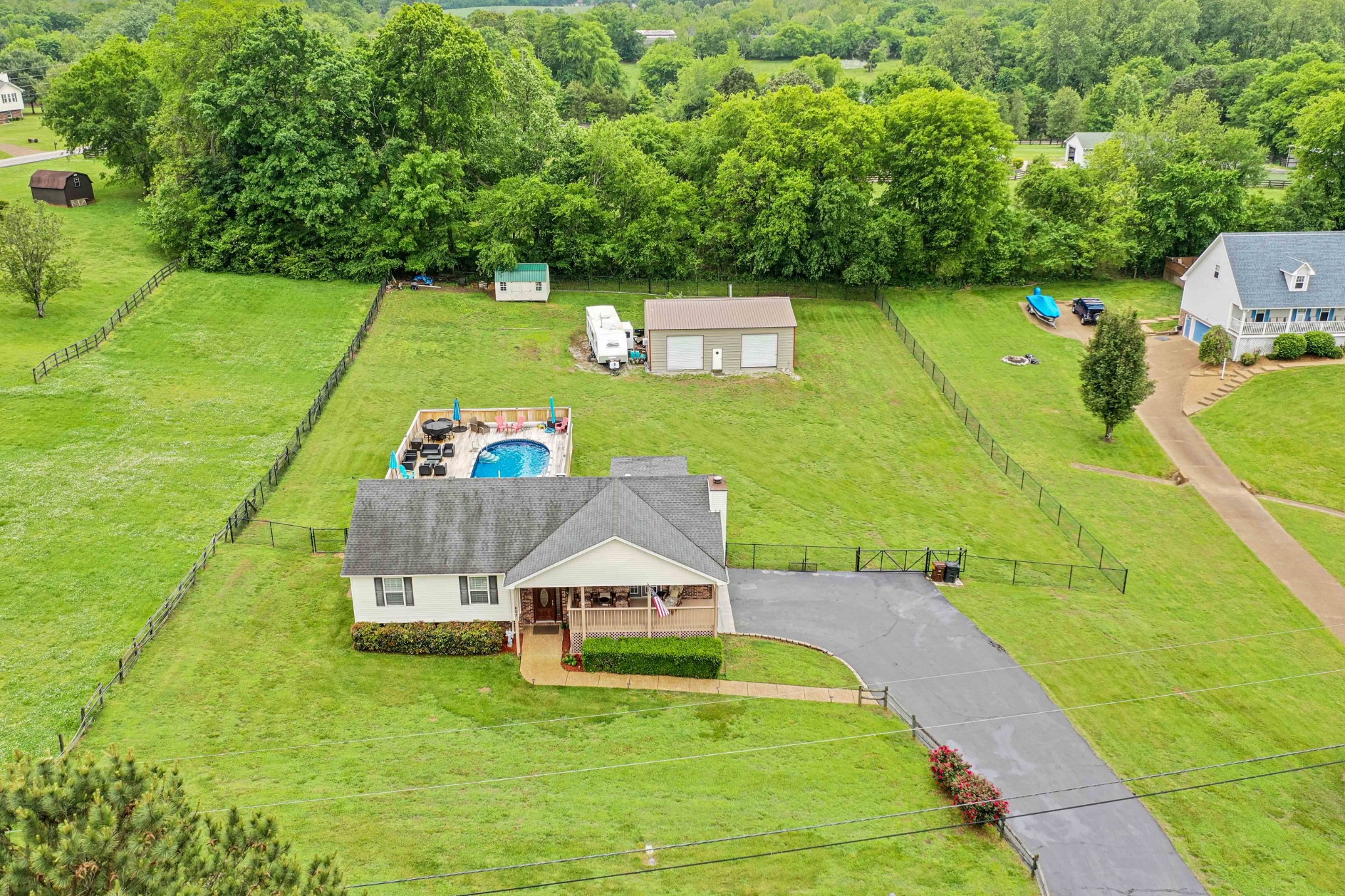 607 Vaughan's Gap Road Spring Hill, TN 37174 - Photo 29 of 34 a view of a pool with a yard