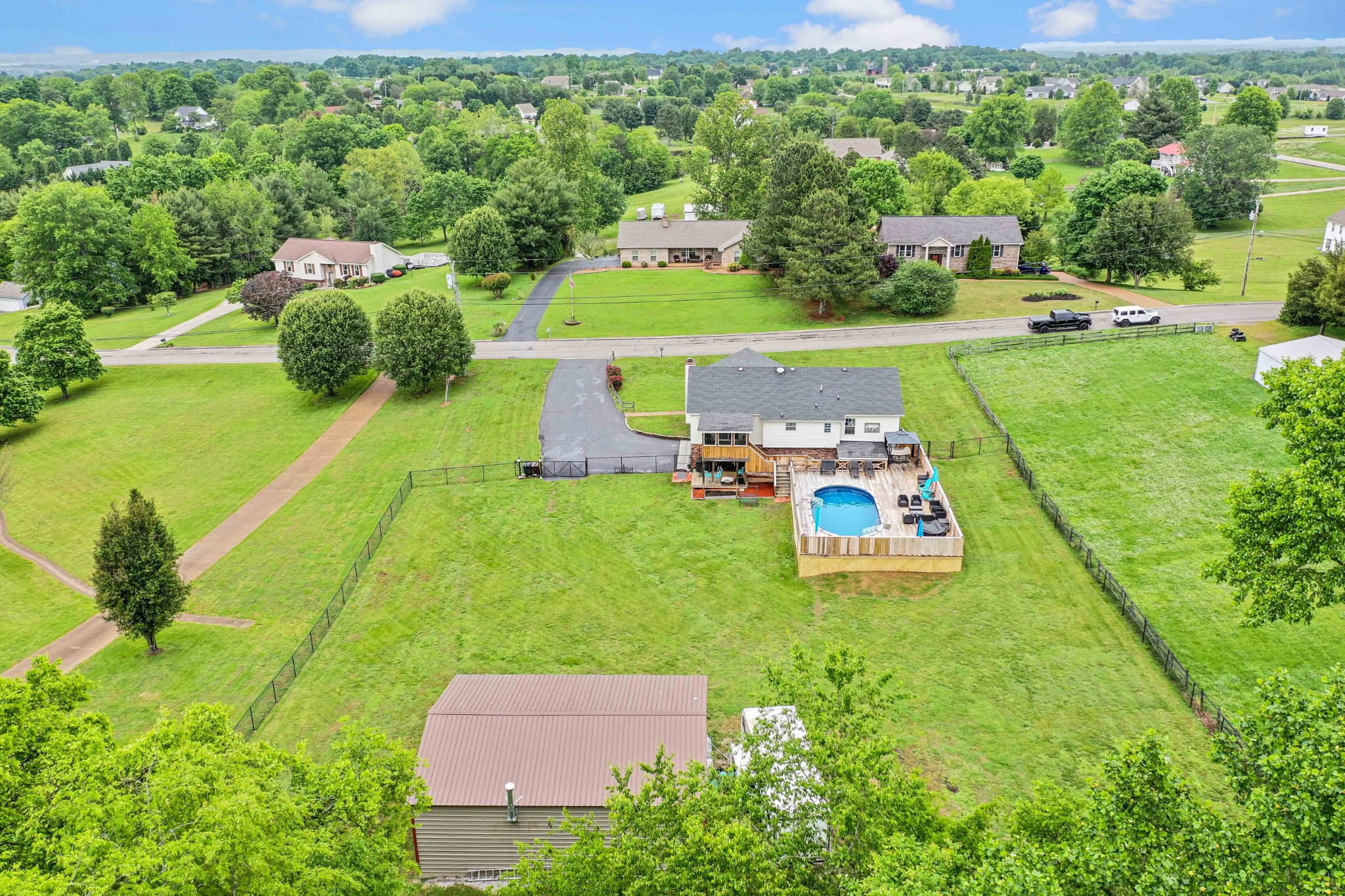 607 Vaughan's Gap Road Spring Hill, TN 37174 - Photo 30 of 34 a aerial view of a house with yard swimming pool and outdoor seating