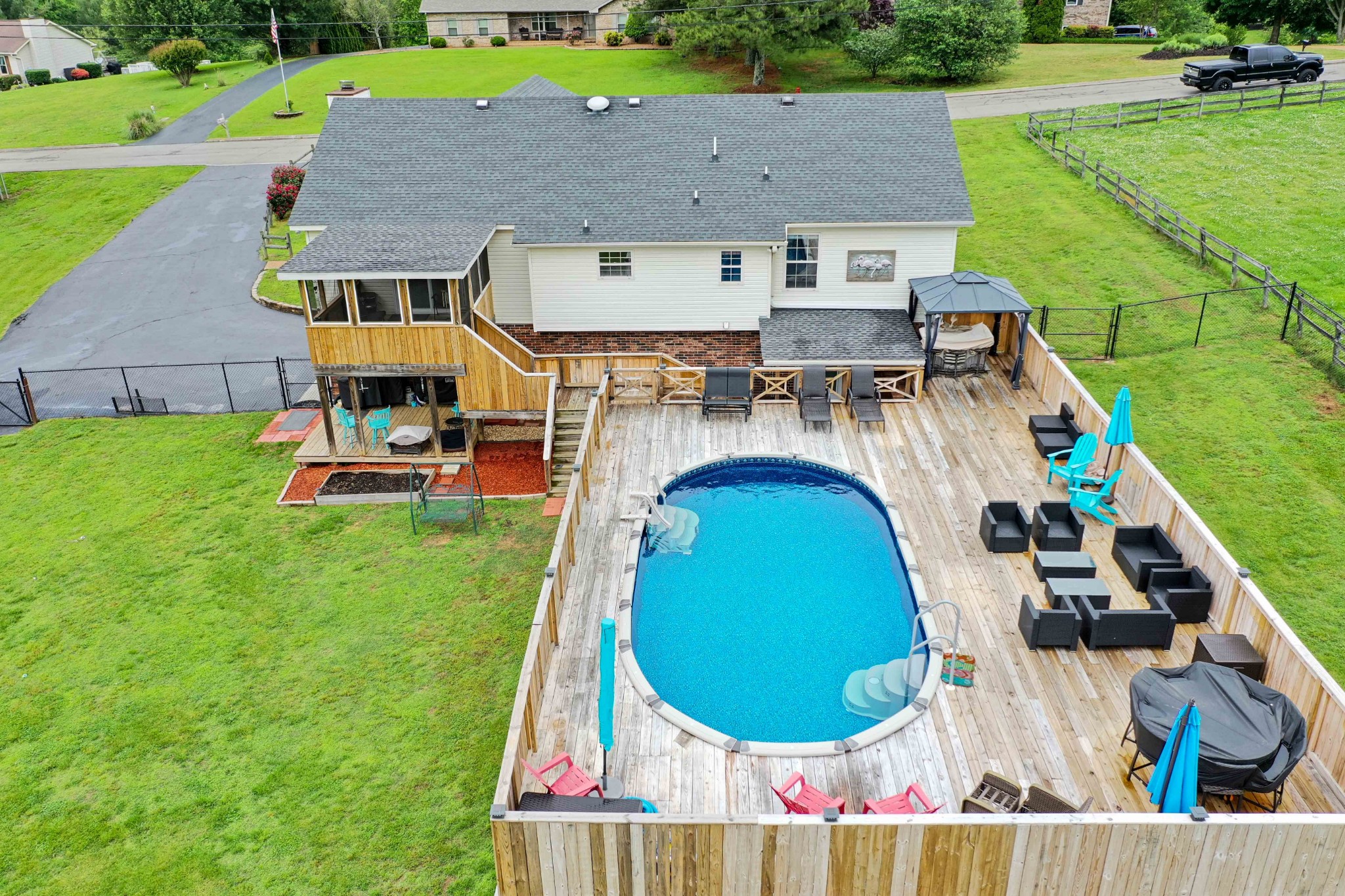 607 Vaughan's Gap Road Spring Hill, TN 37174 - Photo 32 of 34 an aerial view of a house with swimming pool and a yard