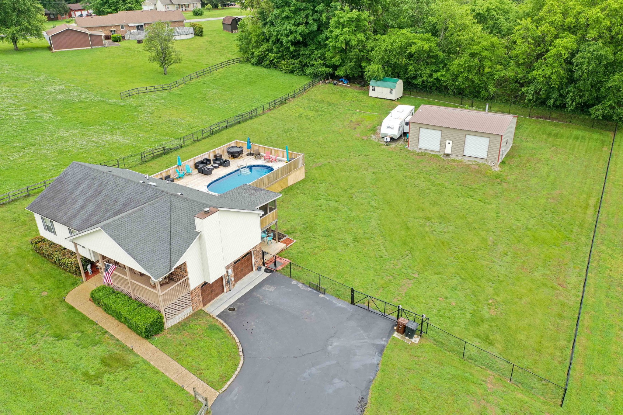 607 Vaughan's Gap Road Spring Hill, TN 37174 - Photo 33 of 34 an aerial view of a house with a garden and swimming pool