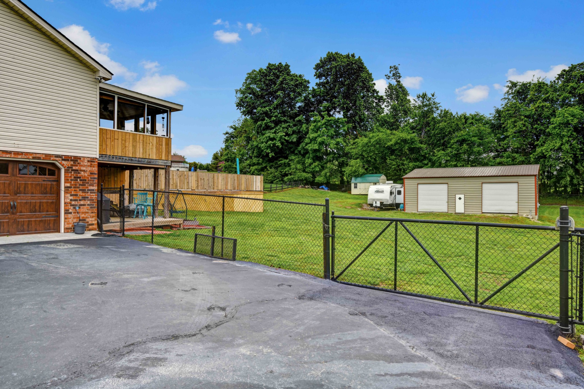 607 Vaughan's Gap Road Spring Hill, TN 37174 - Photo 5 of 34 a view of a backyard that has a car parked