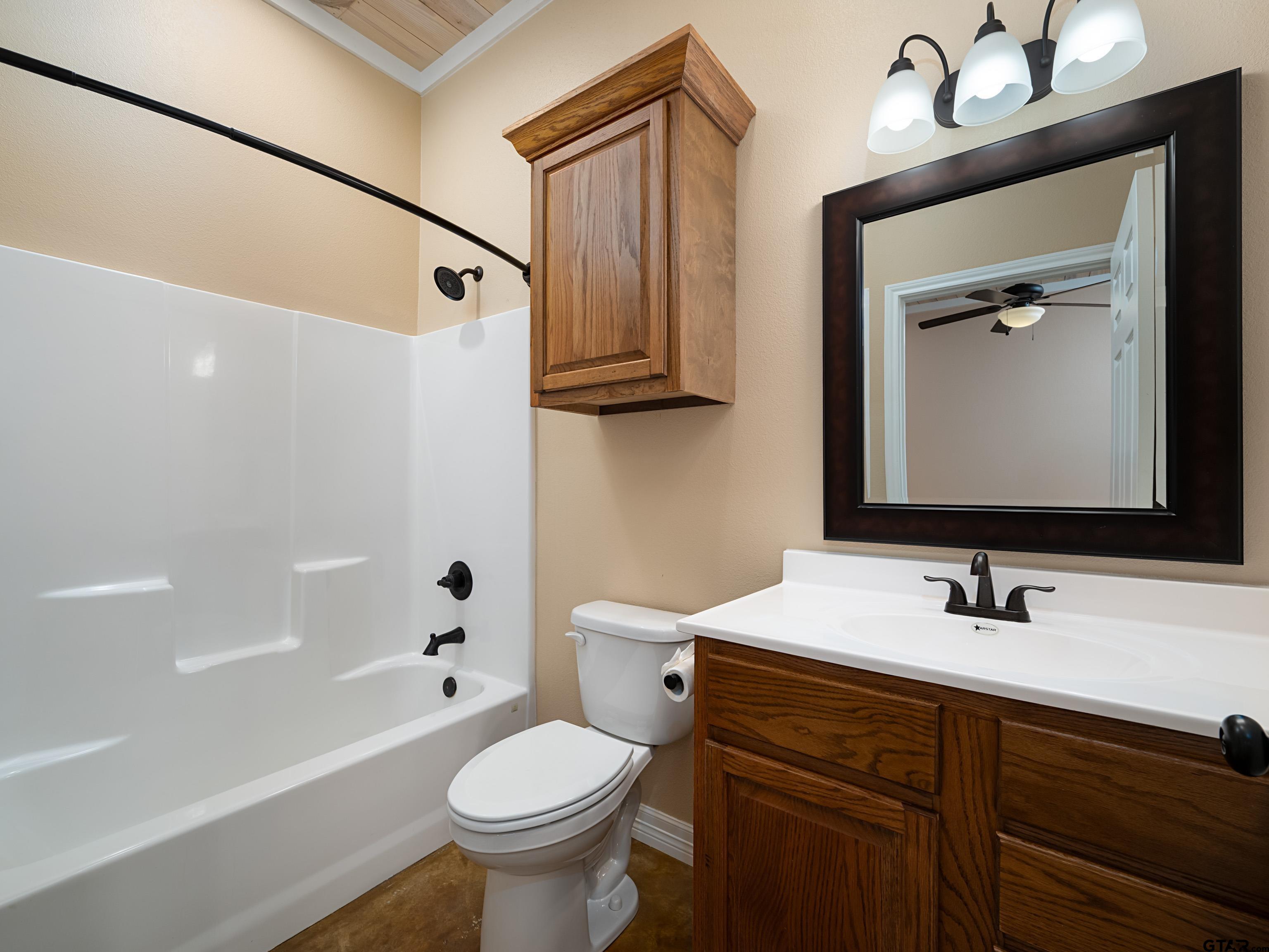 271 Front Street Palestine, TX 75803 - Photo 14 of 25 a bathroom with a sink toilet and shower