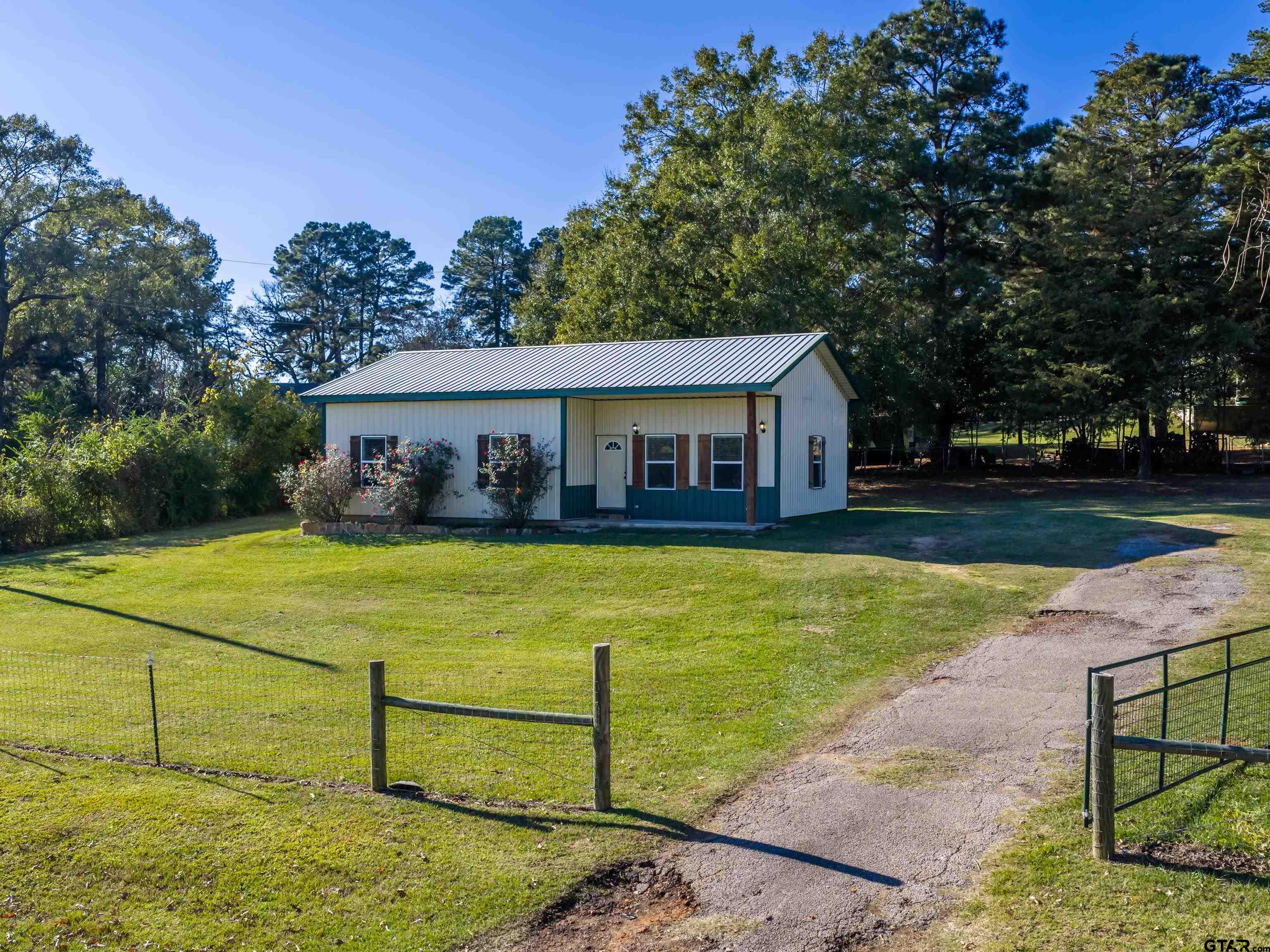 271 Front Street Palestine, TX 75803 - Photo 3 of 25 a front view of a house with swimming pool