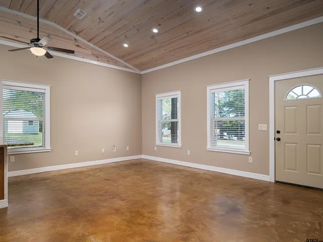 a view of an empty room with a window