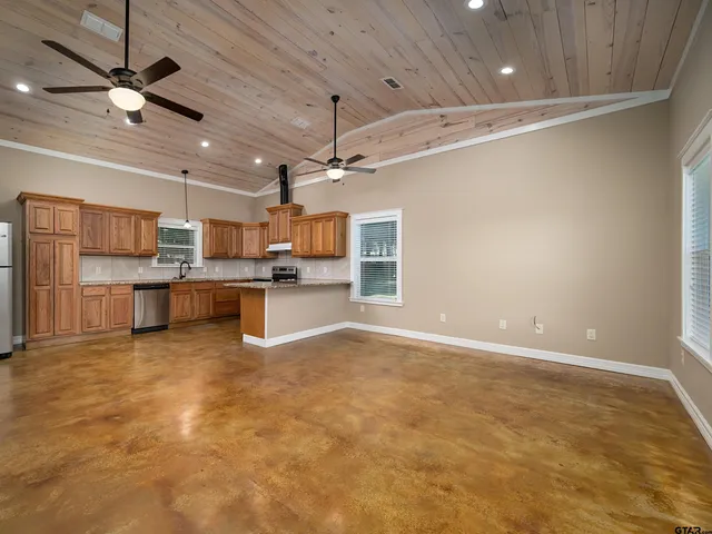 a view of a kitchen with a sink and microwave