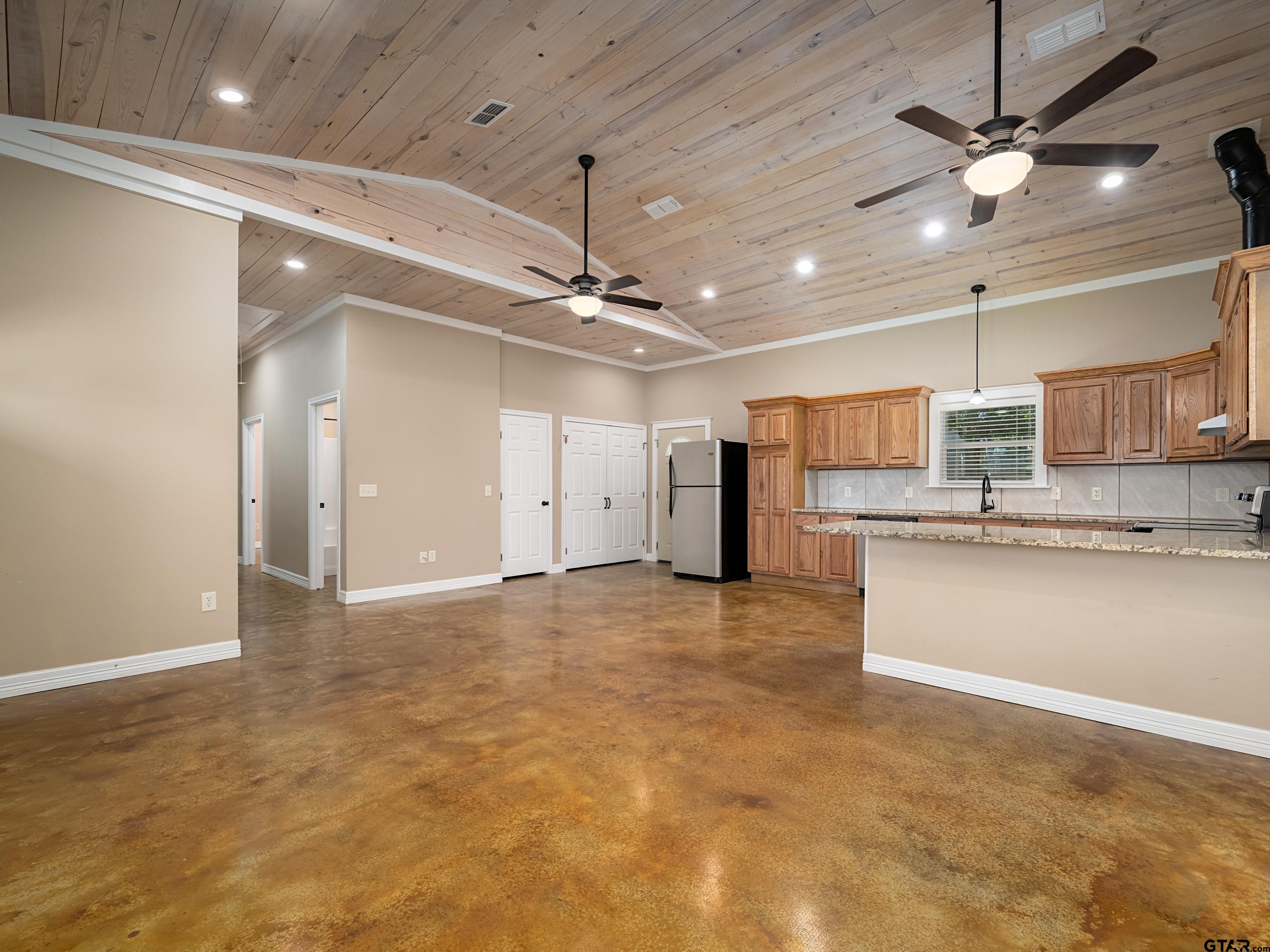 271 Front Street Palestine, TX 75803 - Photo 7 of 25 a view of a kitchen with a sink and a refrigerator