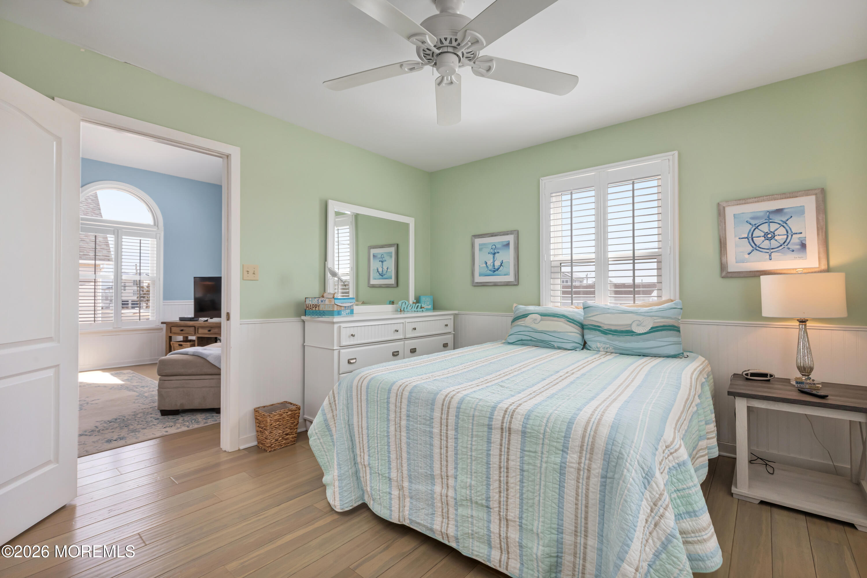 170 Flamingo Road Tuckerton, NJ 08087 - Photo 25 of 41 a bedroom with a large bed and a chandelier