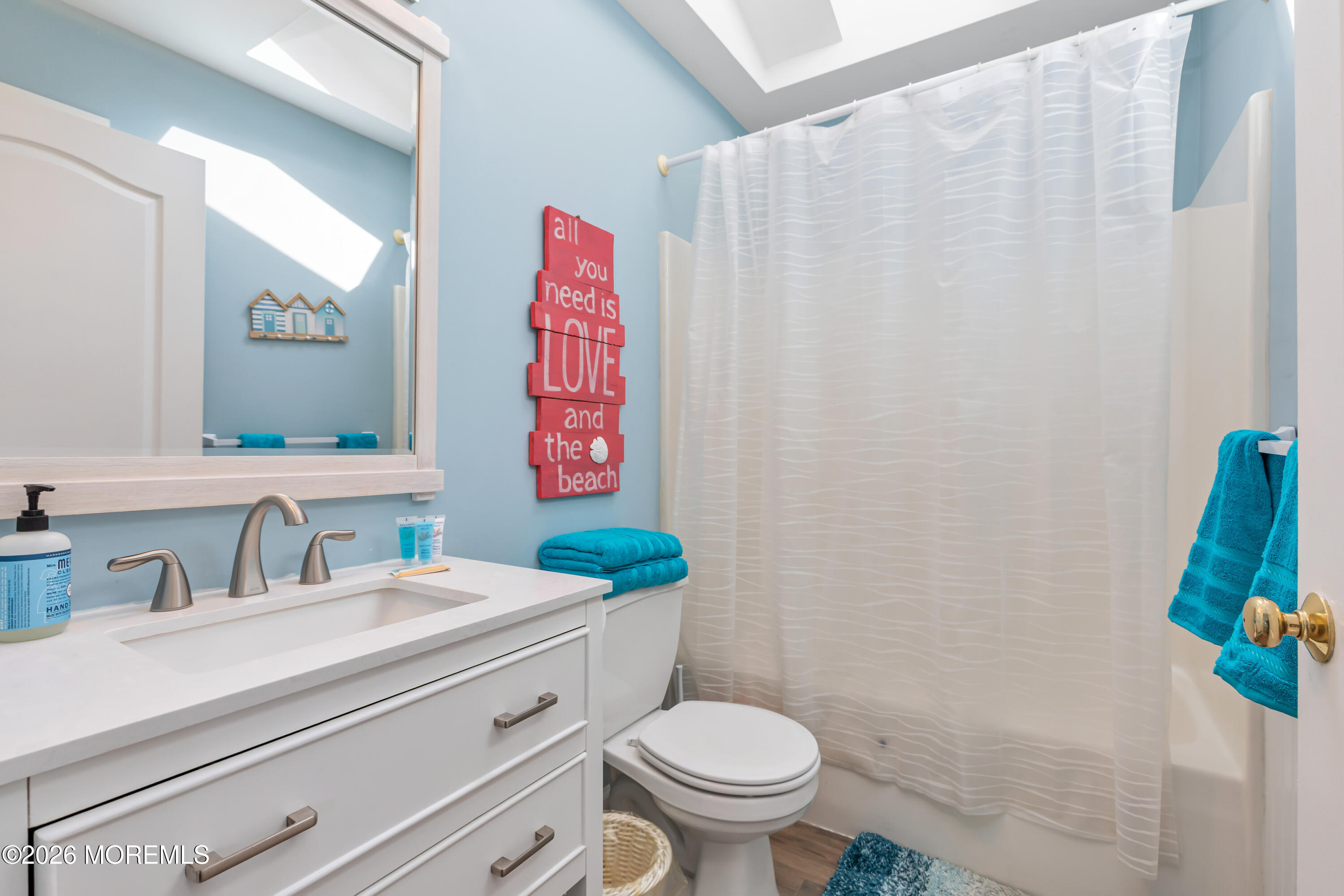 170 Flamingo Road Tuckerton, NJ 08087 - Photo 29 of 41 a bathroom with a sink a toilet and a mirror