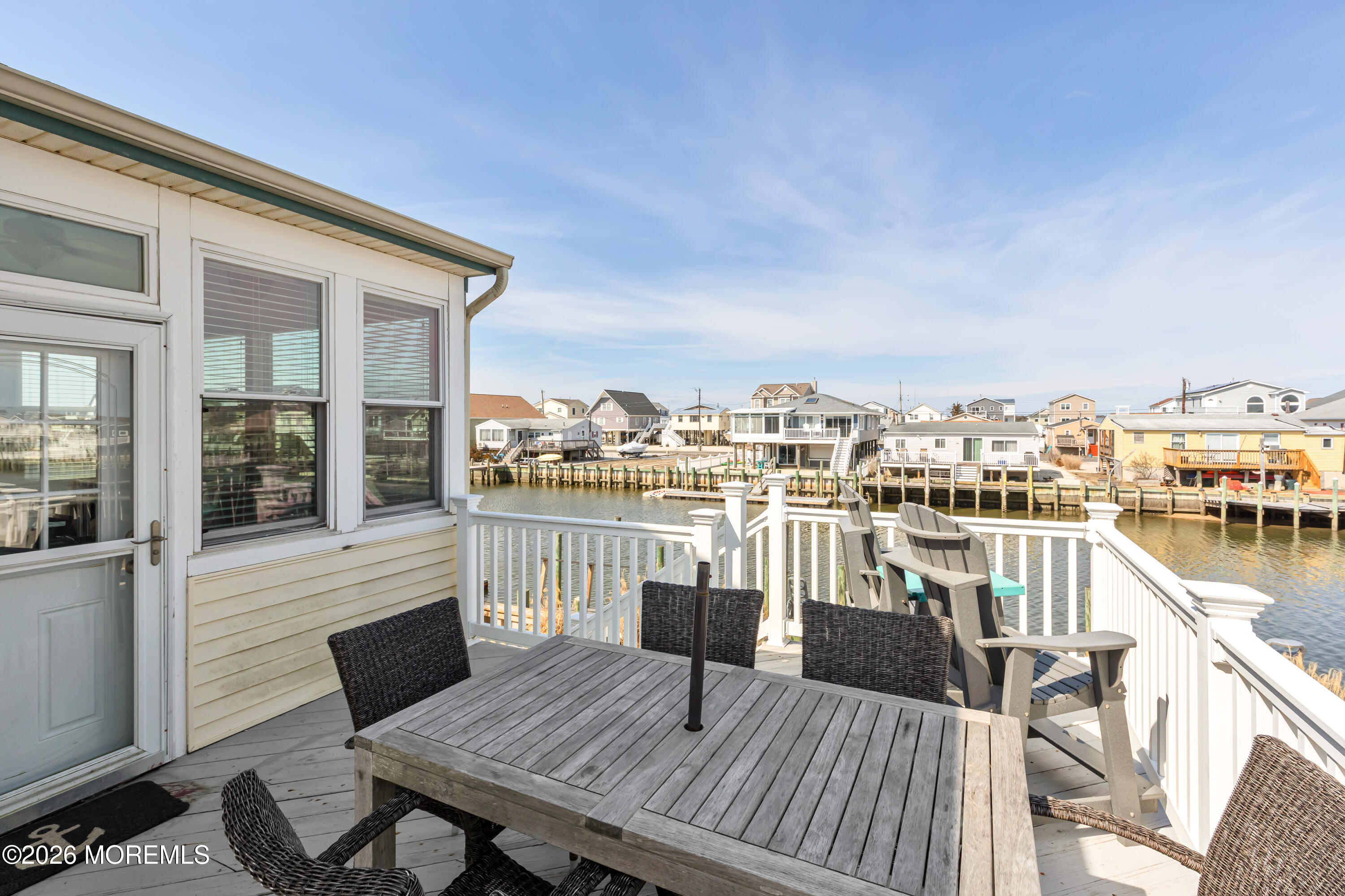 170 Flamingo Road Tuckerton, NJ 08087 - Photo 32 of 41 a view of a balcony with a table and chairs