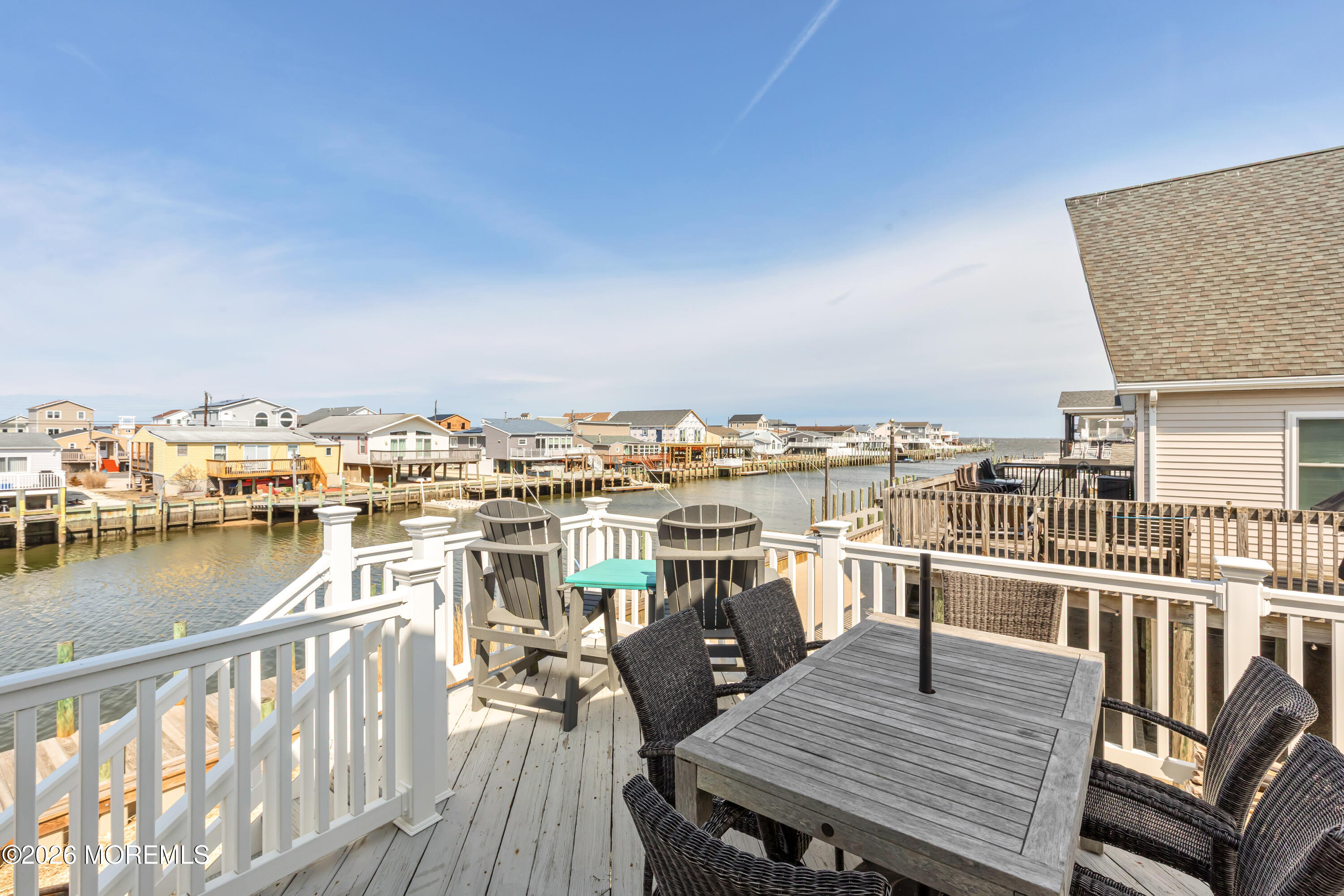170 Flamingo Road Tuckerton, NJ 08087 - Photo 33 of 41 a view of a rooftop deck with chairs and wooden floor