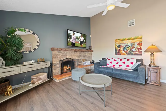 a living room with furniture and a fireplace