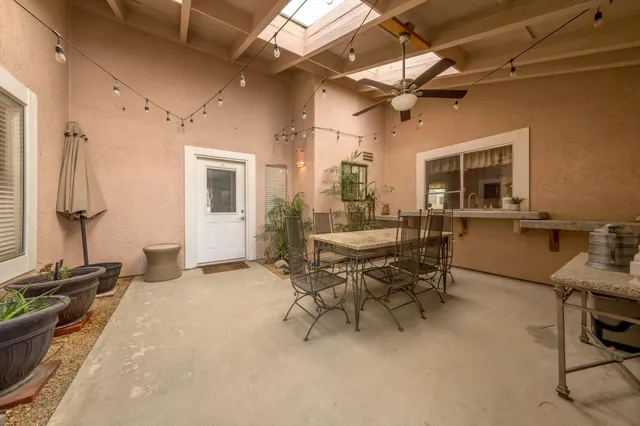 a view of a livingroom with furniture and a table