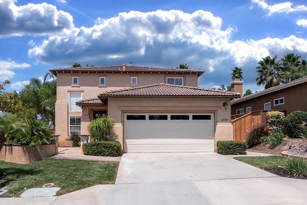 31110 Firestone Street Temecula, CA 92591 - Photo 1 of 1 a front view of a house with a yard