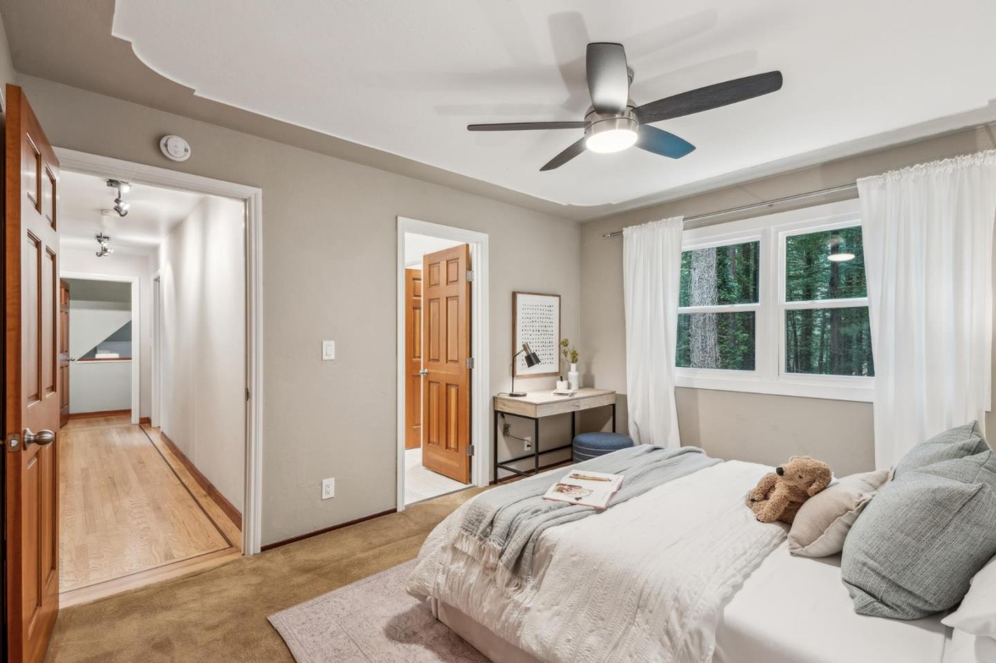 13872 Silver Sky Way Woodside, CA 94062 - Photo 46 of 78 a bedroom with a bed and a large window