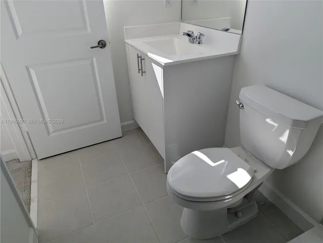 a bathroom with a toilet and a sink