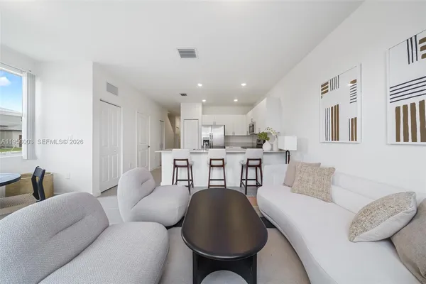 a living room with furniture and a table