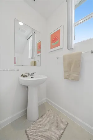 a bathroom with a toilet and a sink