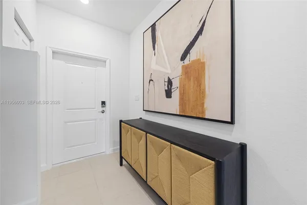 a view of an entryway with wooden floor