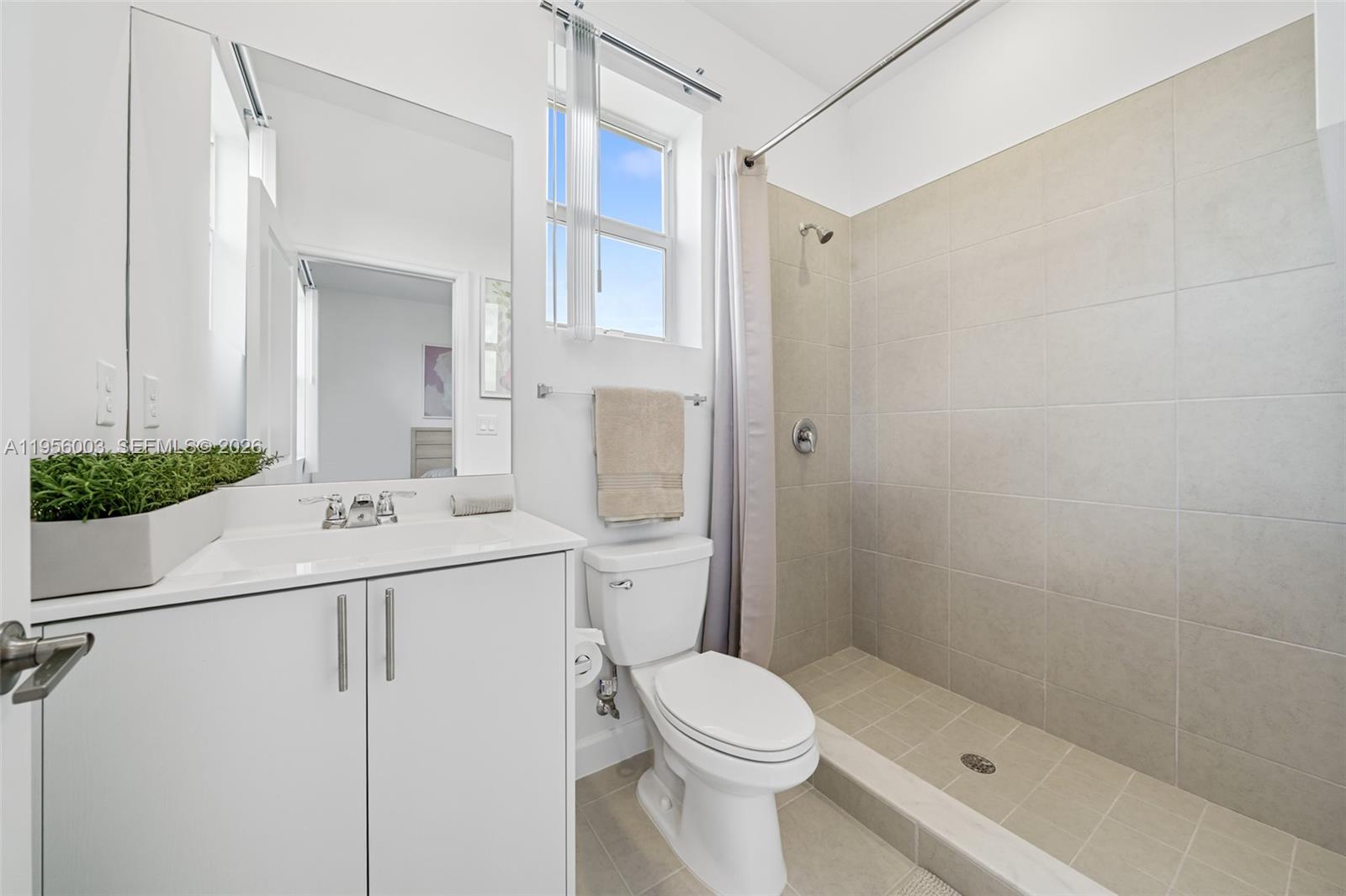 19448 Southwest 338th Terrace Homestead, FL 33034 - Photo 29 of 44 a bathroom with a sink a toilet and shower