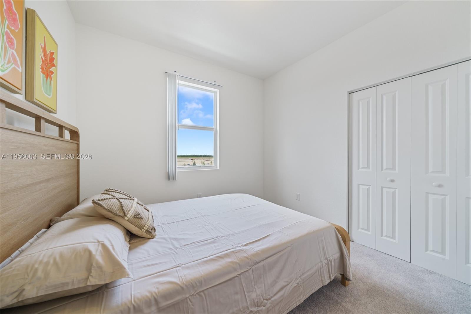 19448 Southwest 338th Terrace Homestead, FL 33034 - Photo 36 of 44 a bedroom with a bed and a window
