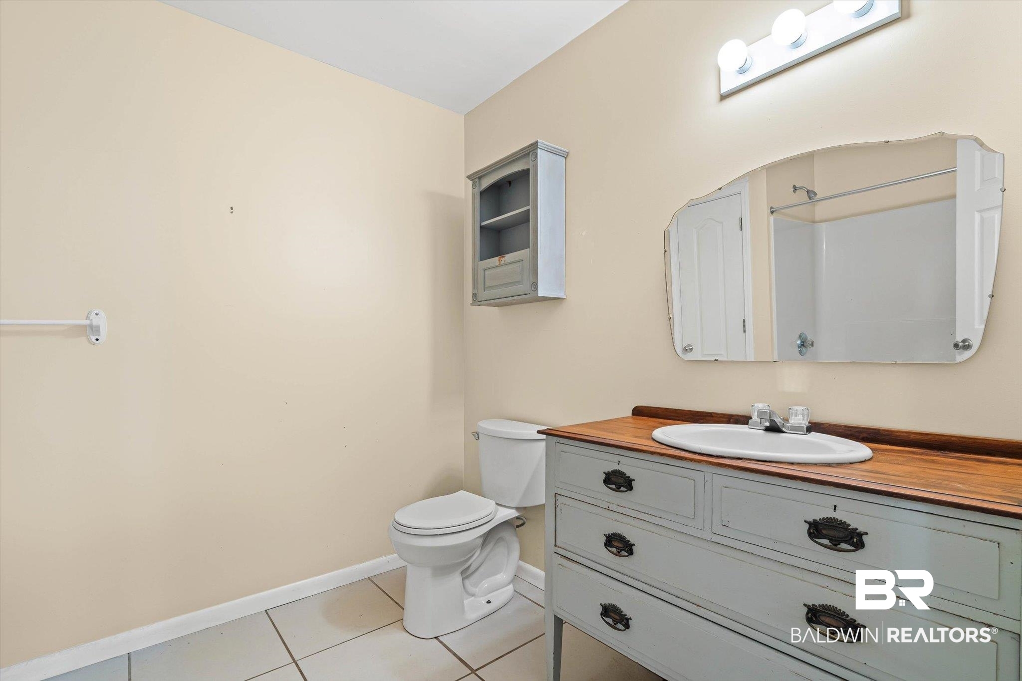 13908 White Road Silverhill, AL 36576 - Photo 16 of 23 Bathroom with light tile patterned floors, vanity, and a shower