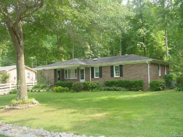 2813 Oak Ridge Court Raleigh, NC 27603 - Photo 1 of 1 a front view of a house with garden