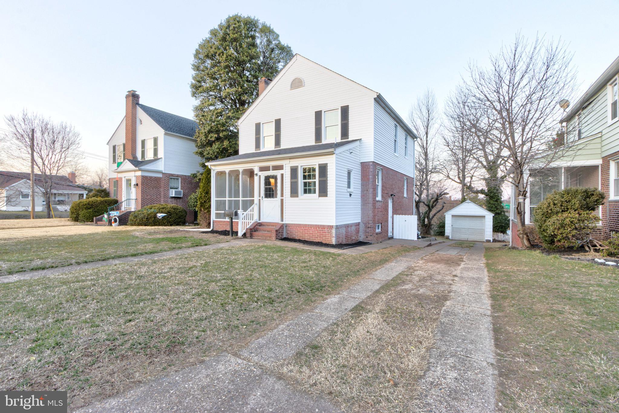 1202 Circle Drive Halethorpe, MD 21227 - Photo 1 of 36 a front view of a house with a yard and garage