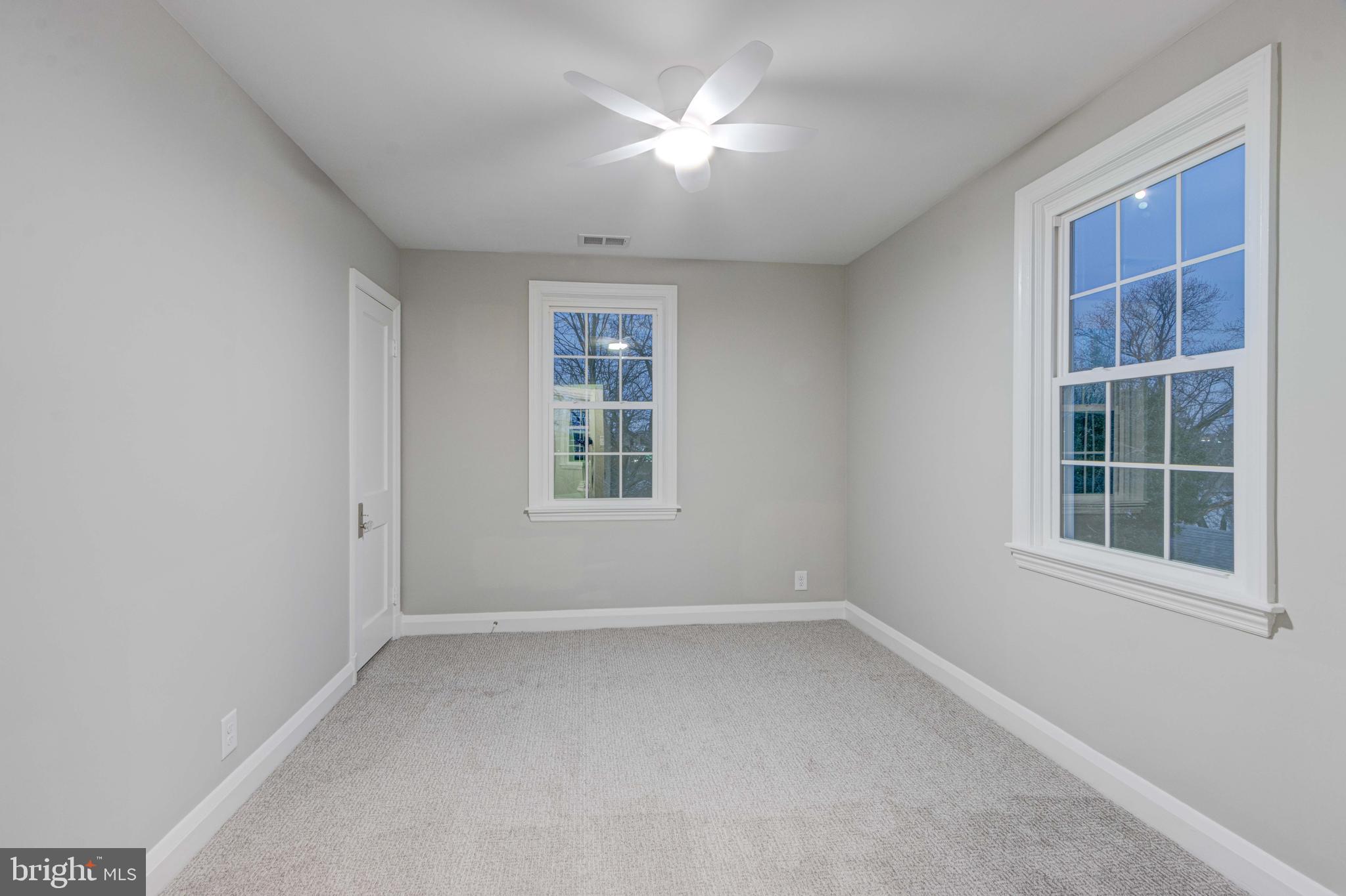 1202 Circle Drive Halethorpe, MD 21227 - Photo 24 of 36 an empty room with a window and a fan
