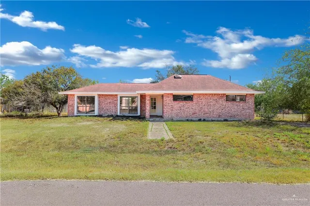 a view of a house with a swimming pool