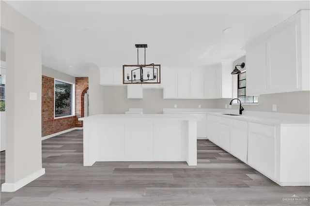 a view of cabinets a sink and dishwasher