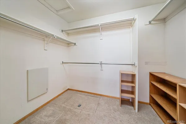 a view of an empty walk in closet