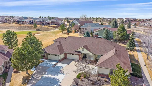 an aerial view of a house with a lake view