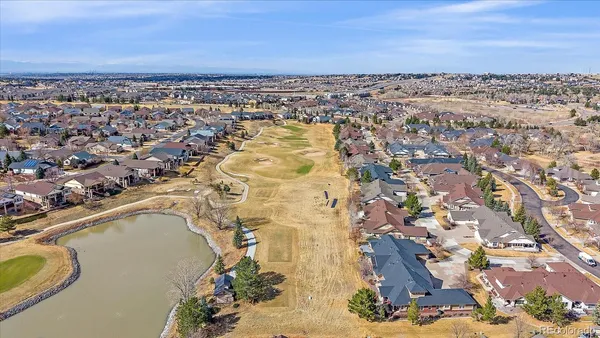 an aerial view of a house with a city view