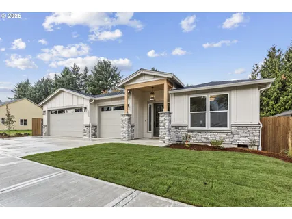 a front view of house with yard and green space