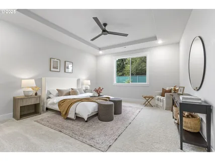 a bedroom with a bed couch and window