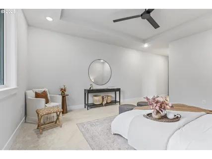 a living room with furniture and a mirror