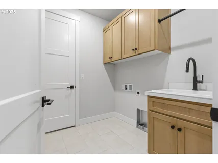 a bathroom with a sink and cabinets