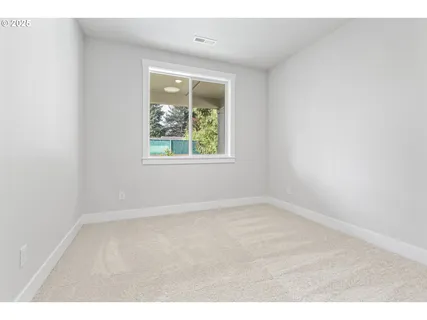 a backyard of a house with a yard and outdoor seating