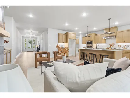 a living room with furniture and a large window