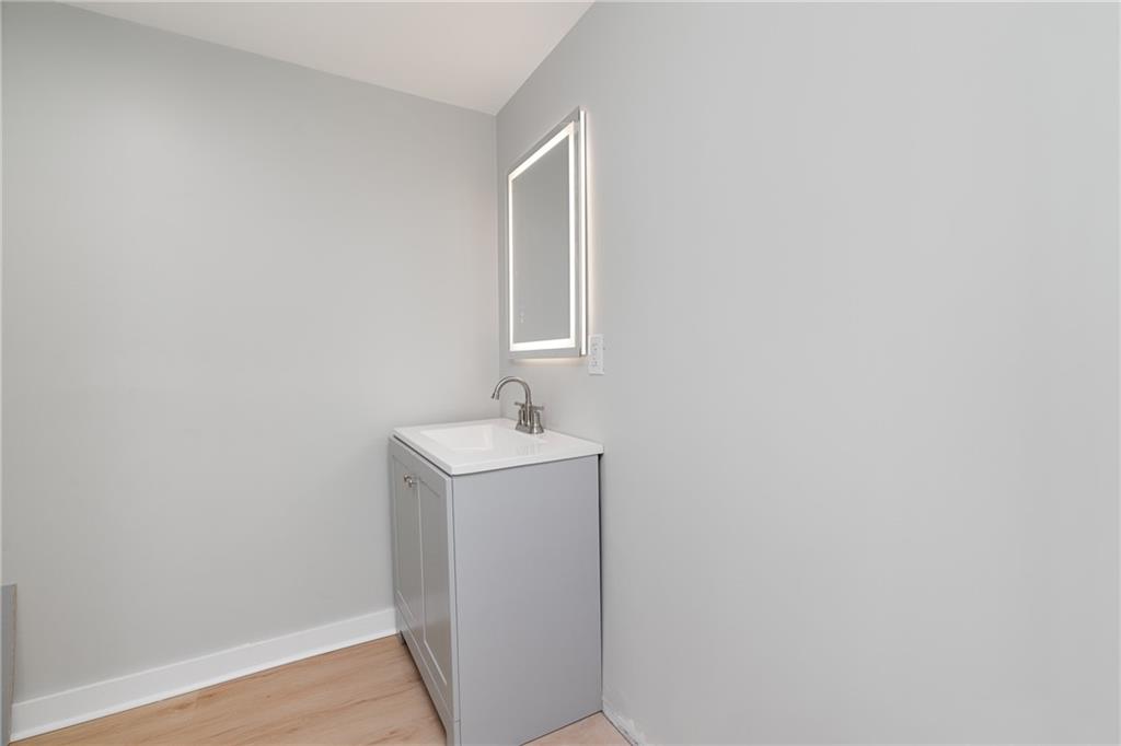 2307 Salisbury Street Pittsburgh, PA 15210 - Photo 12 of 24 a bathroom with a sink and mirror